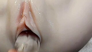 look at that fake cock sliding deep into her pussy