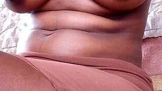 African woman flaunts her thick black ass