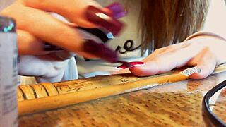 In this ASMR video, long nails caress sexy hands and nails sensually