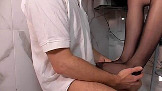 blonde secretary in nylon gives footjob to her boss