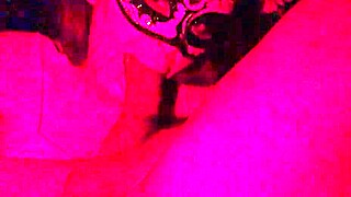 masked in red light sucking cock