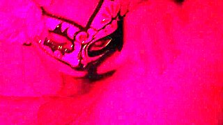 masked in red light sucking cock