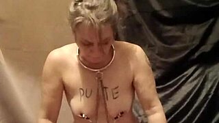 humiliated slave indulges in piss and belt self-session