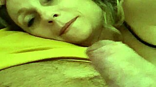 Aline, the beautiful blonde milf, gives a passionate handjob to Flavio, making him orgasm with a cumshot before bedtime