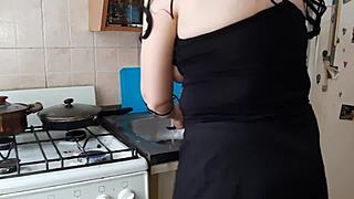 Girlfriend pleasures pussy in kitchen while dinner cooks