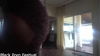 Her black pussy glistens as she gives handjob!