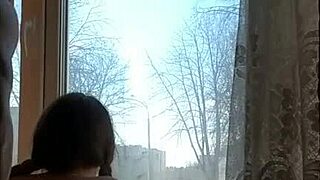 Helga Bosk engages in risky sex by the window as people walk by.