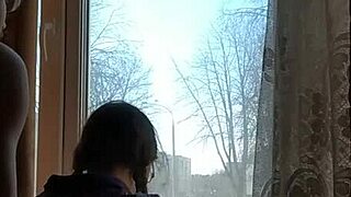 Helga Bosk engages in risky sex by the window as people walk by.