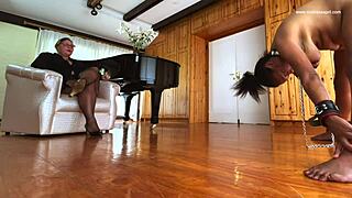 dominatrix april dominates pam with strapon and bondage