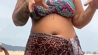 i got naked on the beach in front of the guy he got hard and i grabbed his cock