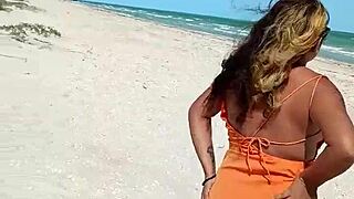 Hey, this horny Mexican babe flashes her thong and tits on the public beach! 😏🌊