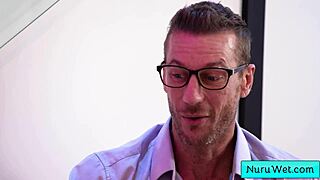 Busty skinny blonde masseuse pours nuru gel, rubs naked on client