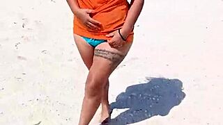Hey, this horny Mexican babe flashes her thong and tits on the public beach! 😏🌊