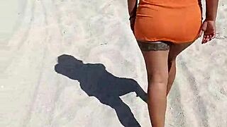 Hey, this horny Mexican babe flashes her thong and tits on the public beach! 😏🌊