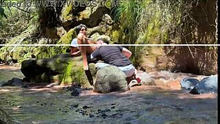 Amateur couple records outdoor adventure by the river