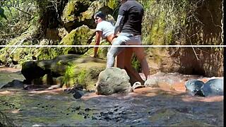 Amateur couple records outdoor adventure by the river
