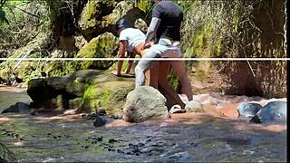 Amateur couple records outdoor adventure by the river