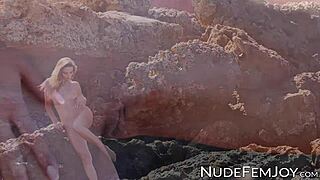 Beautiful babe teases perfect body on beach