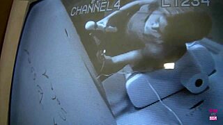 Blonde Nina Rae uses a sex toy while sucking a big dick through a glory hole