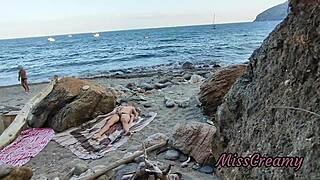 girl flashes on public beach and gets help