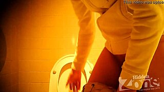 Beautiful girl pees standing up in toilet