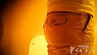 Beautiful girl pees standing up in toilet