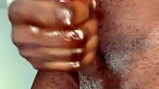 ninja man masturbates his big black cock and cums hard.