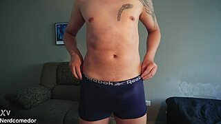 nerd strips underwear and jerks huge cock to orgasm