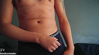 nerd strips underwear and jerks huge cock to orgasm