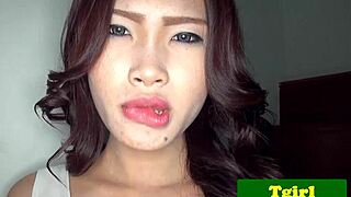 The Asian ladyboy, alone on the stairs, begins teasing herself by tugging her cock slowly.