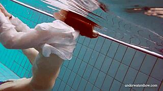 European redhead babe lola with big natural tits swims underwater