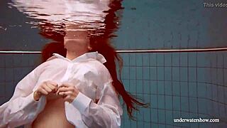 European redhead babe lola with big natural tits swims underwater