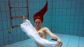 European redhead babe lola with big natural tits swims underwater