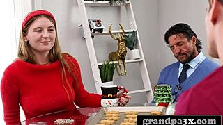 old man in santa suit gives young slut a big cock present