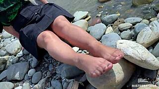 Goddess teases with nylon soles on riverside 😘