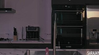 Sara Jay in Kitchen Using Pink Dildo on Big Tits