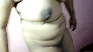 Curvy Indian woman masturbates intensely on bed with huge natural tits for first time