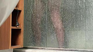 bbw gets caught stroking her fat pussy in the steamy shower
