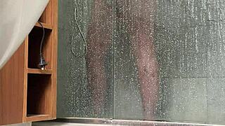 bbw gets caught stroking her fat pussy in the steamy shower