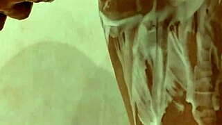 NAKED BIG TITS MILF LATHERS UP IN STEAMY SHOWER SHOWDOWN!