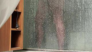 bbw gets caught stroking her fat pussy in the steamy shower
