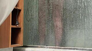 bbw gets caught stroking her fat pussy in the steamy shower