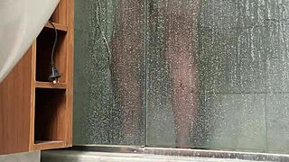 bbw gets caught stroking her fat pussy in the steamy shower