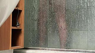 bbw gets caught stroking her fat pussy in the steamy shower