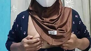 pretty hijab student pleasures herself alone in quiet house