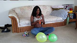 Black French woman meticulously inflates big balloons in detailed fetish sequence step by step