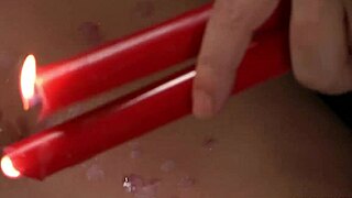 Redhead Endures Wax Play in Bondage for Intense Release