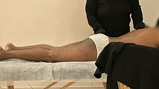 Hidden cam catches masseuse's teasing handjob finish