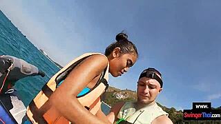 asian girlfriend sneaks blowjob thrill on public jetski ride with boyfriend under sun