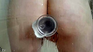 woman bathes under shower using dildo toy on wet pussy for steamy wet fun relaxation